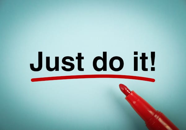 A sky blue paint and a red marker with a word JUST DO IT